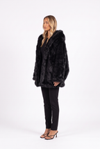 Oversized shaggy faux fur hooded coat in black — side