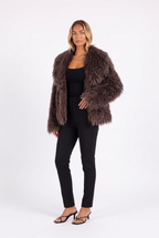 Brown shaggy faux fur jacket with oversized shawl collar — three-quarter